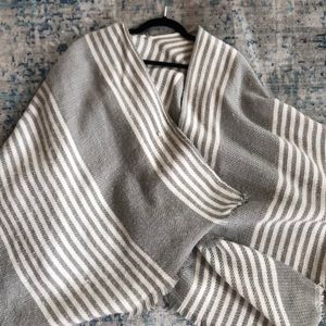 Gray and white striped sweater poncho